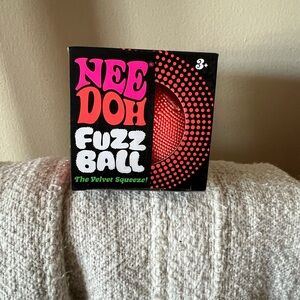 Viral Nee Doh Fuzz Ball the velvet touch in orange